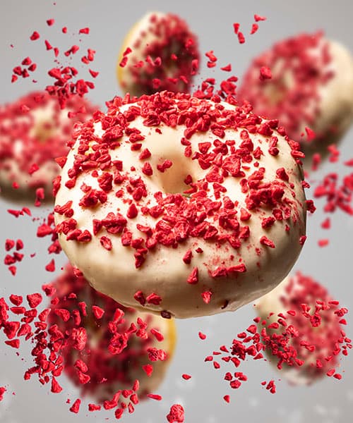 Image Frosted donut with strawberry sprinkles